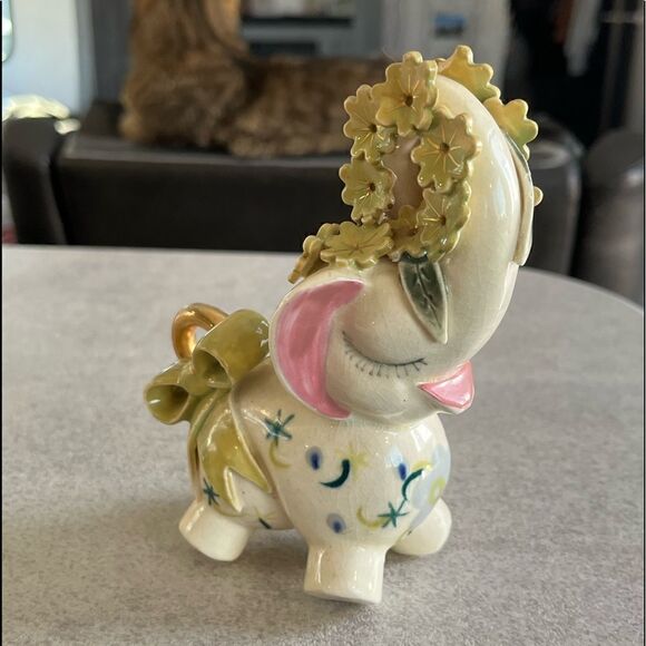 A decorated Elephant? Ceramic. Pink ears. Nose in air. Flowers on trunk. Eyelash - Picture 6 of 14
